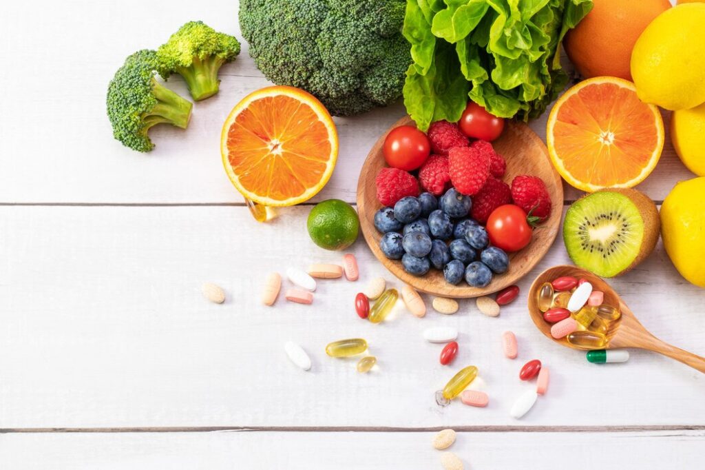 top view fresh fruits vegetables with different medicine wooden spoon 181624 47137